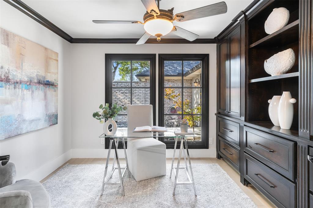 3922 Inwood Road Dallas, TX 75209 - Photo 18 of 35 a living room with furniture a chandelier and a large window