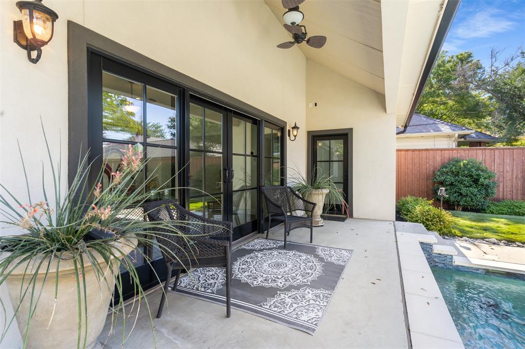 3922 Inwood Road Dallas, TX 75209 - Photo 30 of 35 a living room with patio furniture and a garden