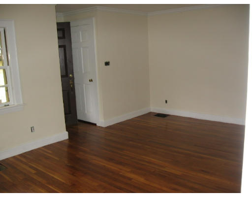 53 Pierrepont Road Newton, MA 02462 - Photo 6 of 13 an empty room with wooden floor and windows
