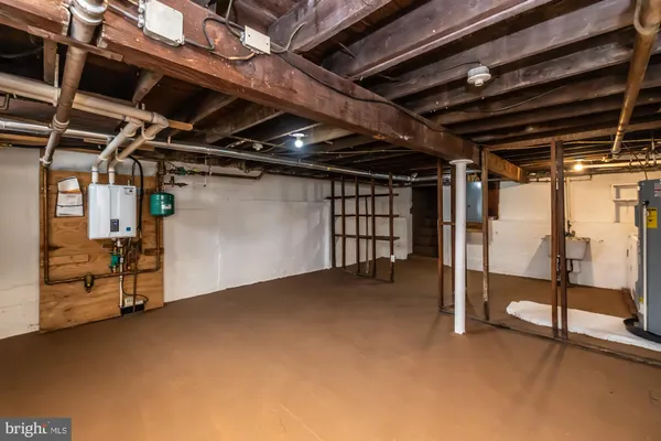 a view of empty room with wooden ceiling