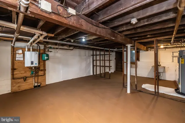 a view of empty room with wooden ceiling