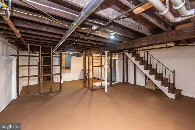 a view of an empty room with stairs