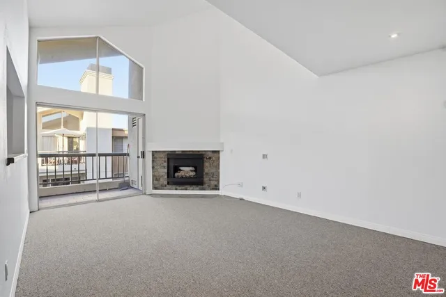 an empty room with a fireplace