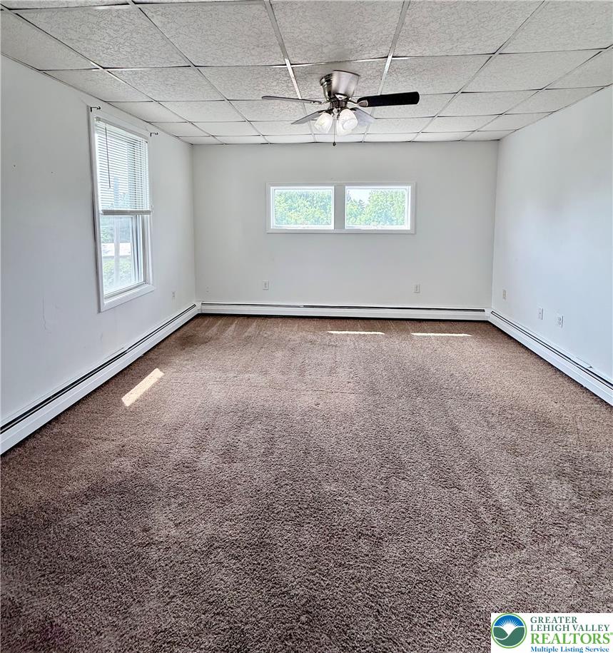 5540 Main Street Whitehall, PA 18052 - Photo 29 of 53 A spacious room offers ample natural light and plush carpeting throughout.