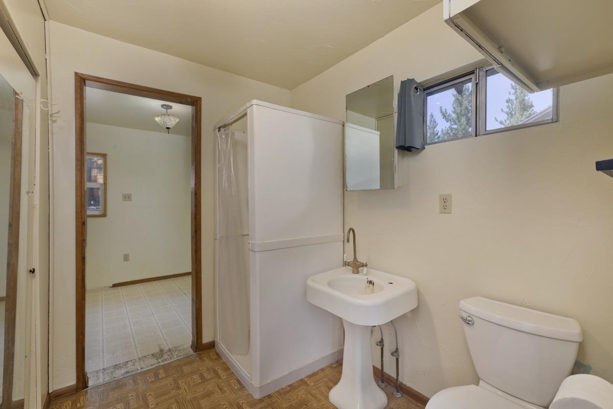 2030 Old Mammoth Road Mammoth Lakes, CA 93546 - Photo 32 of 46 a bathroom with a sink mirror and toilet