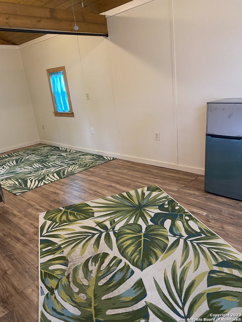 100 Timber Road, Unit 3 Pipe Creek, TX 78063 - Photo 4 of 11 a bedroom with a bed