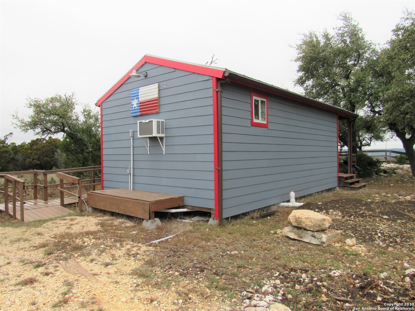 100 Timber Road, Unit 3 Pipe Creek, TX 78063 - Photo 10 of 11 a front view of a house with a yard