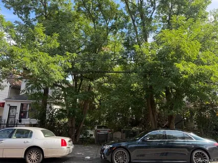 a view of a car parked in back of a house