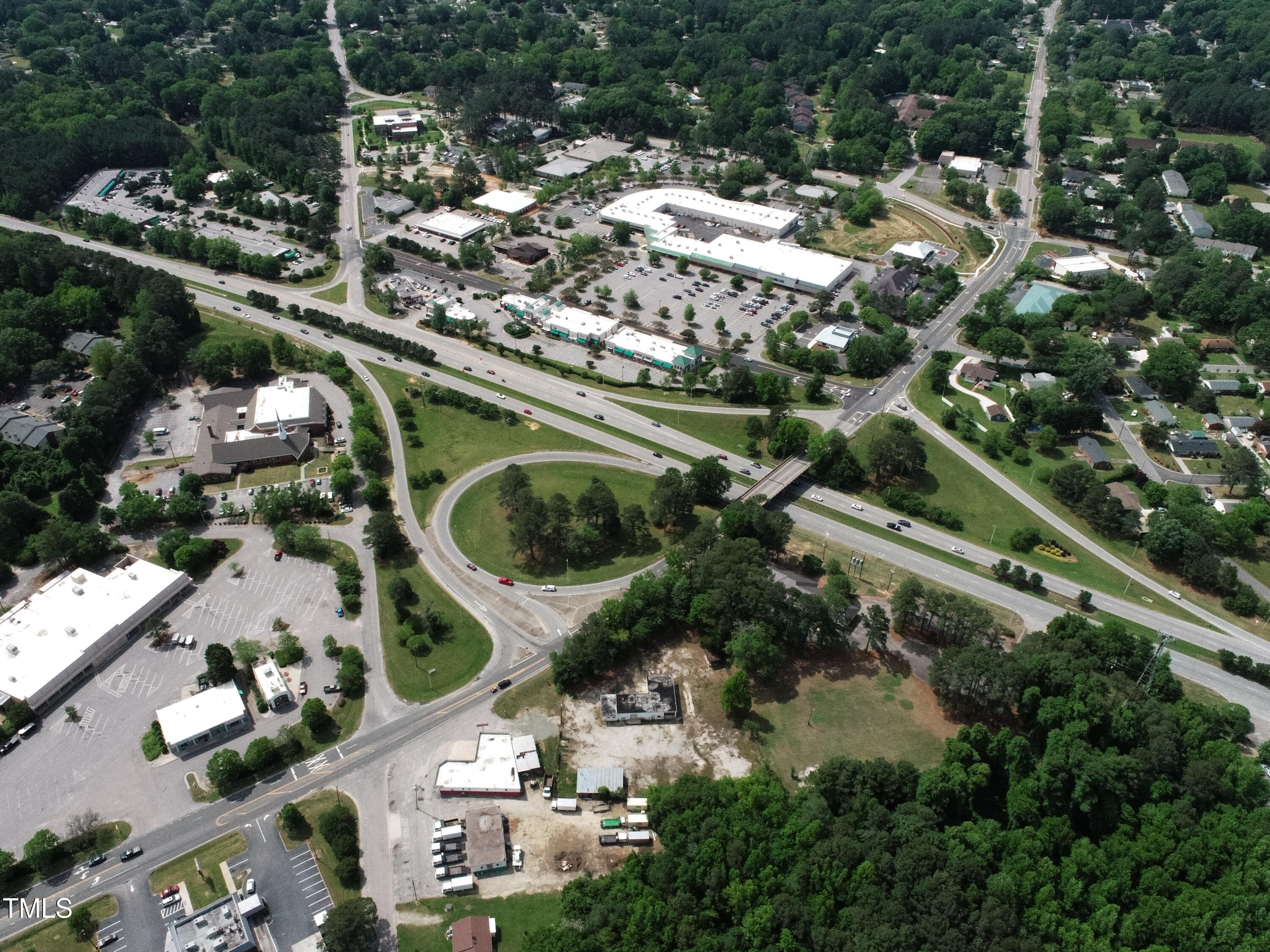 an aerial view of residential houses with outdoor space and street view