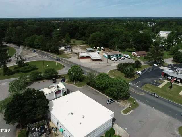 an aerial view of a house with outdoor space