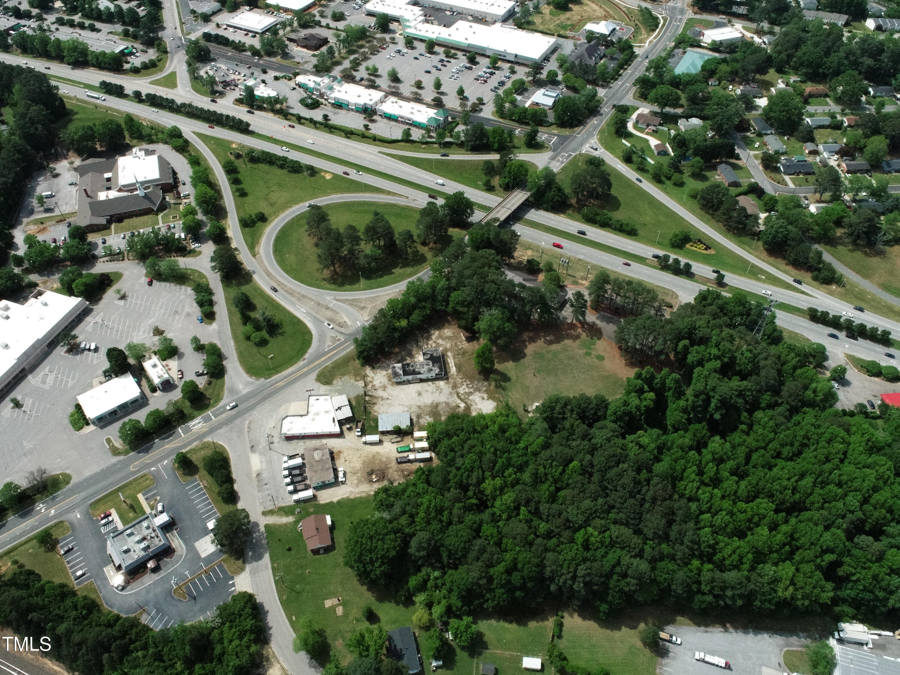 200 Vandora Springs Road Garner, NC 27529 - Photo 14 of 37 an aerial view of a house with a yard and lake view