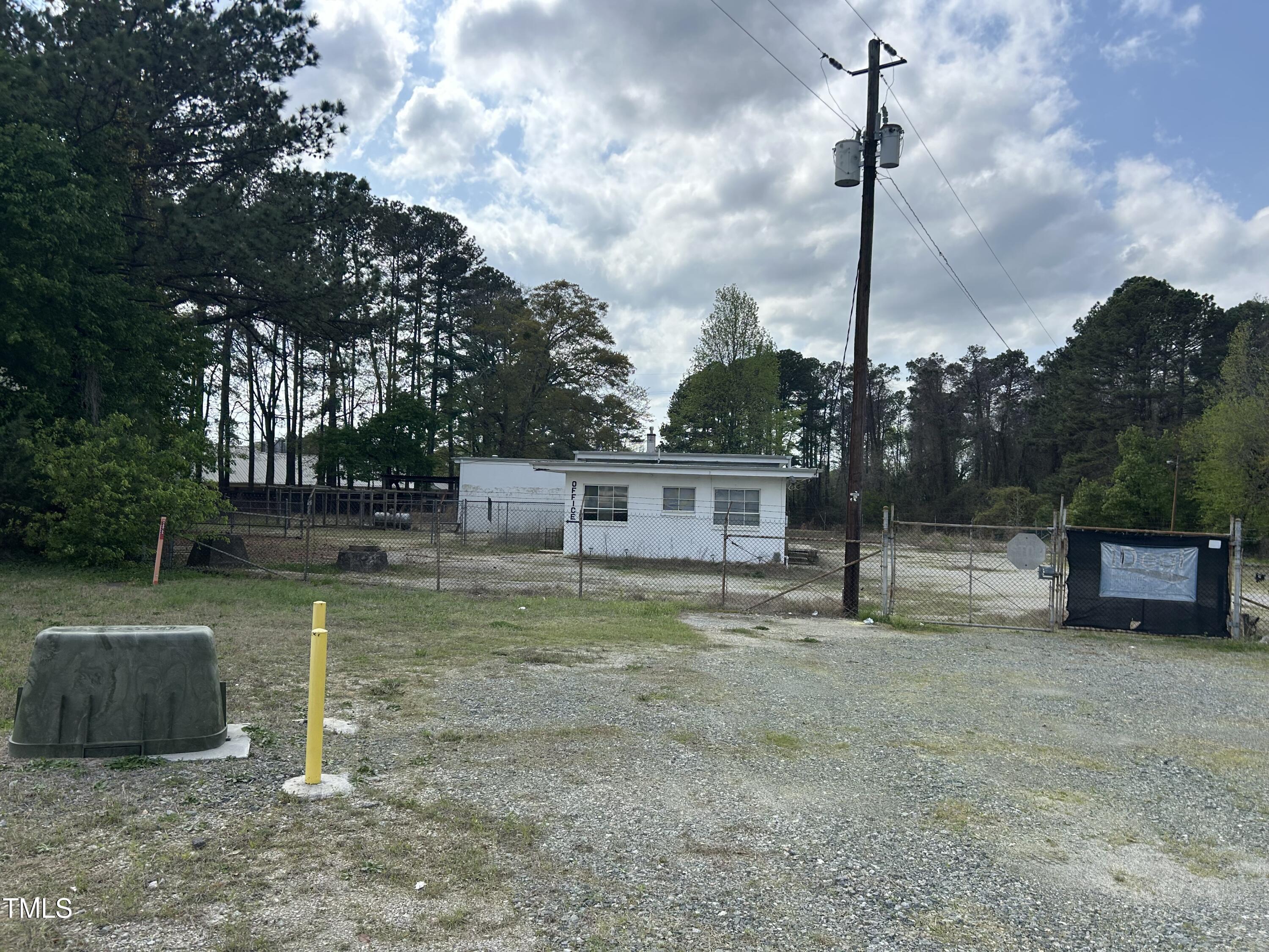 200 Vandora Springs Road Garner, NC 27529 - Photo 21 of 37 a view of a house with a backyard and a tree