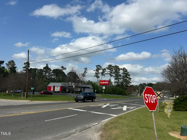 a view of street and electric pole on its side