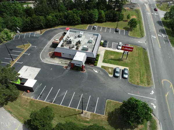an aerial view of a house with outdoor space