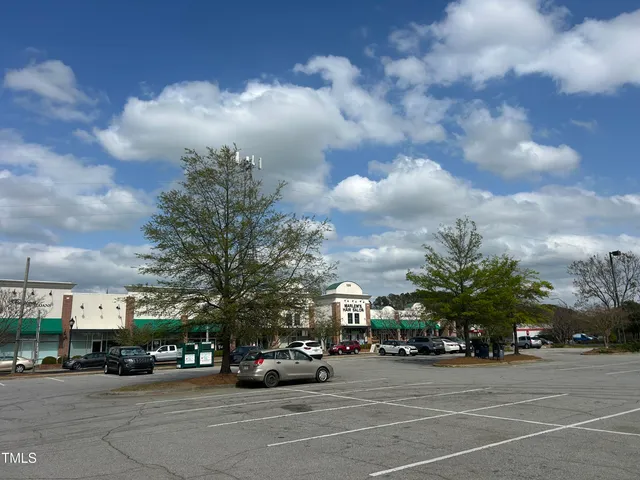 a view of a cars parked in front of a building