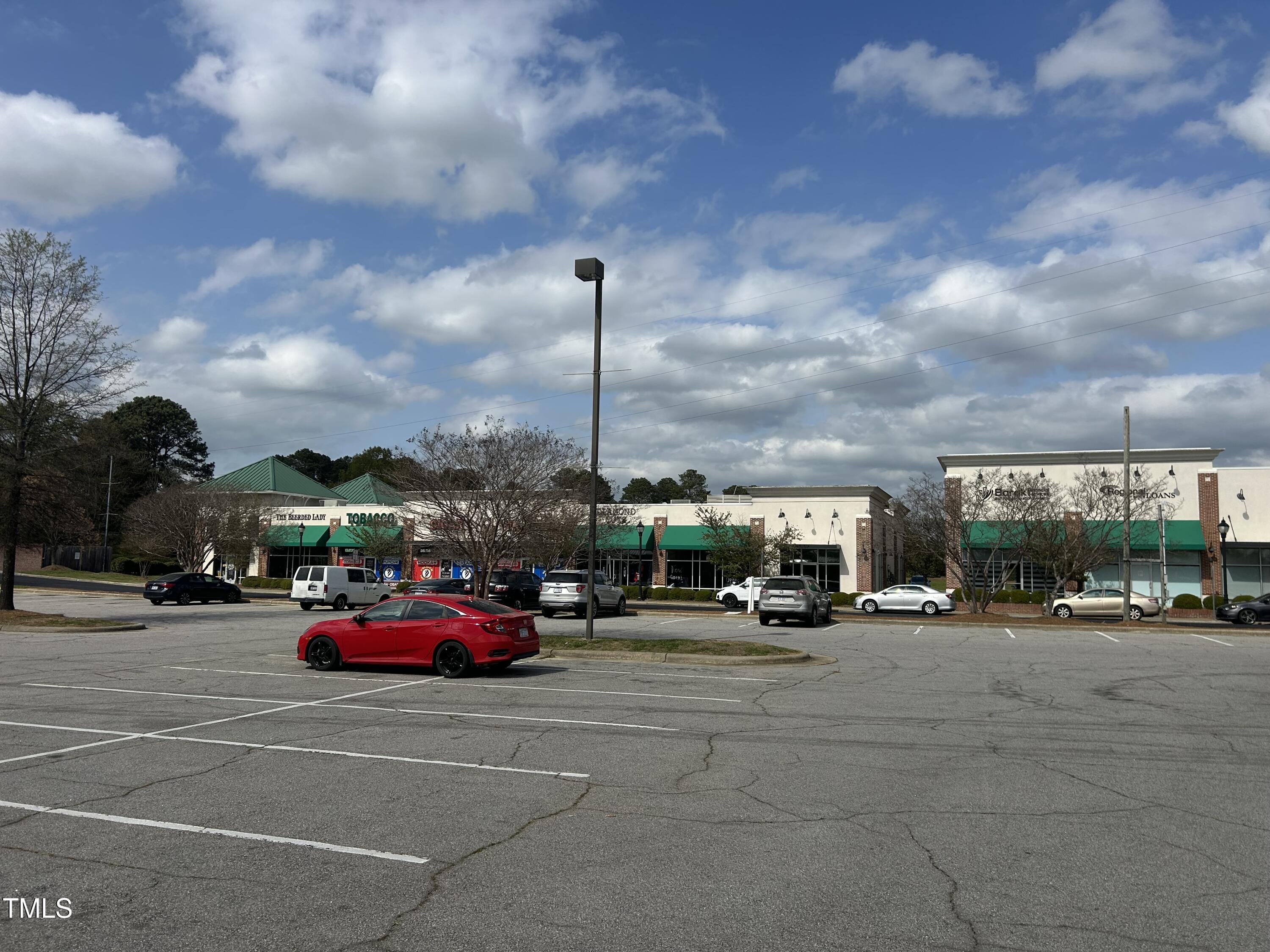 200 Vandora Springs Road Garner, NC 27529 - Photo 34 of 37 a cars parked in front of a building