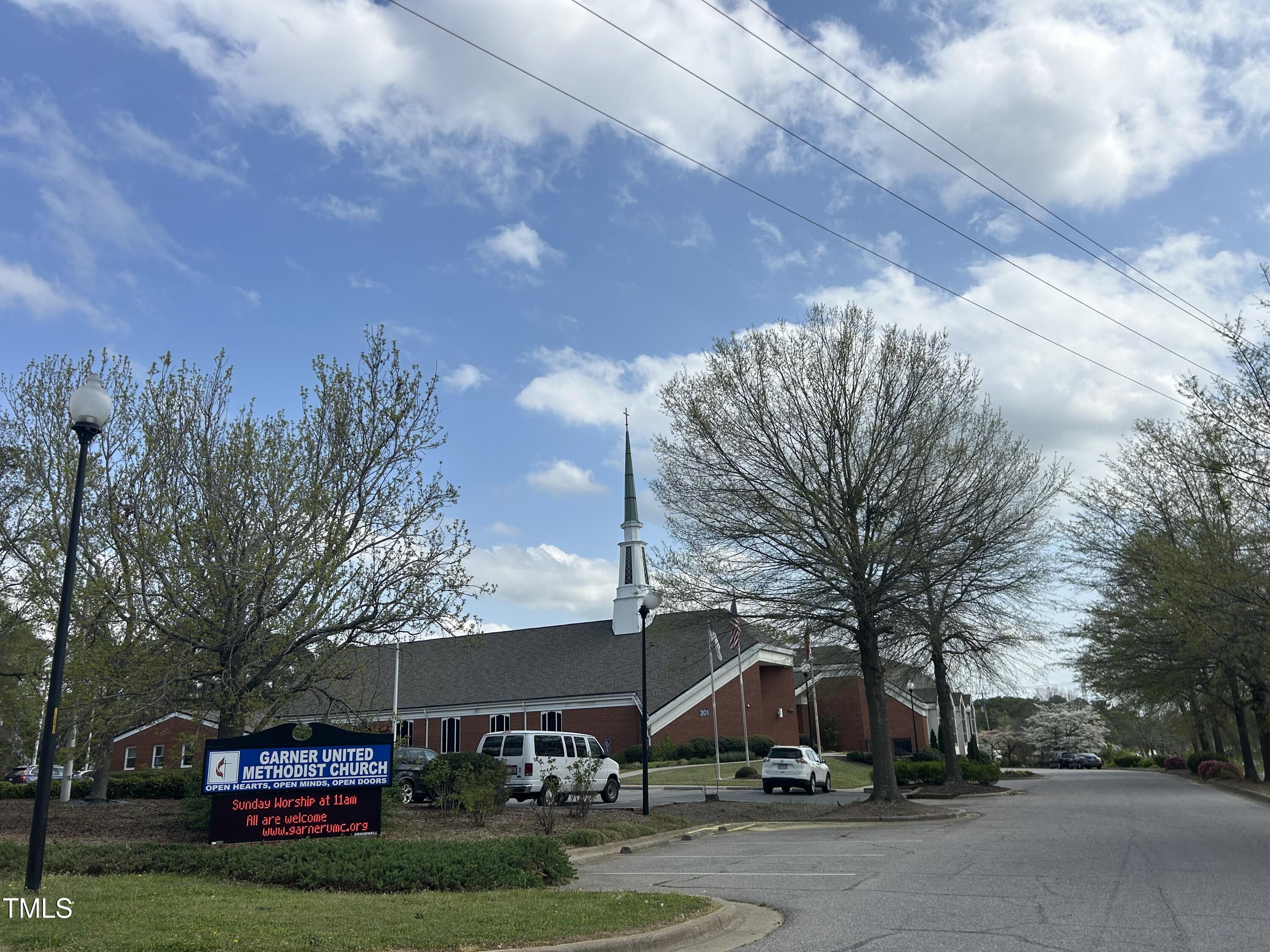 200 Vandora Springs Road Garner, NC 27529 - Photo 36 of 37 a front view of a house with a yard and trees