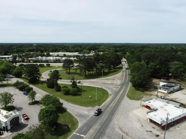 a view of a swimming pool with a yard