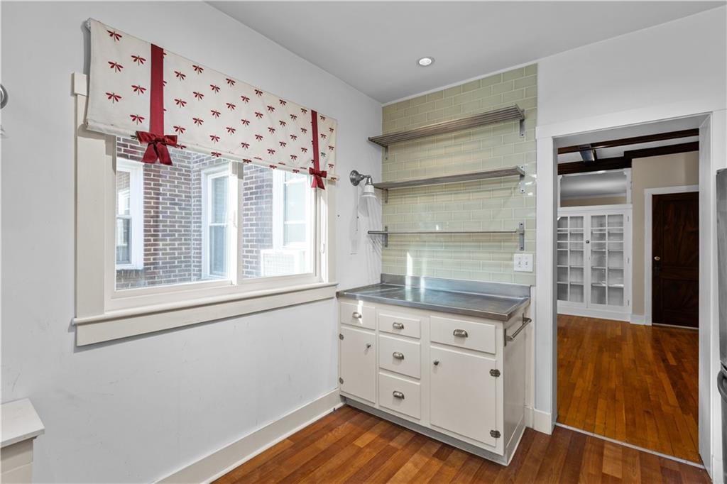 6314 Forward Avenue Pittsburgh, PA 15217 - Photo 13 of 27 wooden floor in an empty room with a window