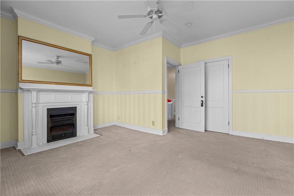 6314 Forward Avenue Pittsburgh, PA 15217 - Photo 14 of 27 a view of an empty room with a fireplace and a window