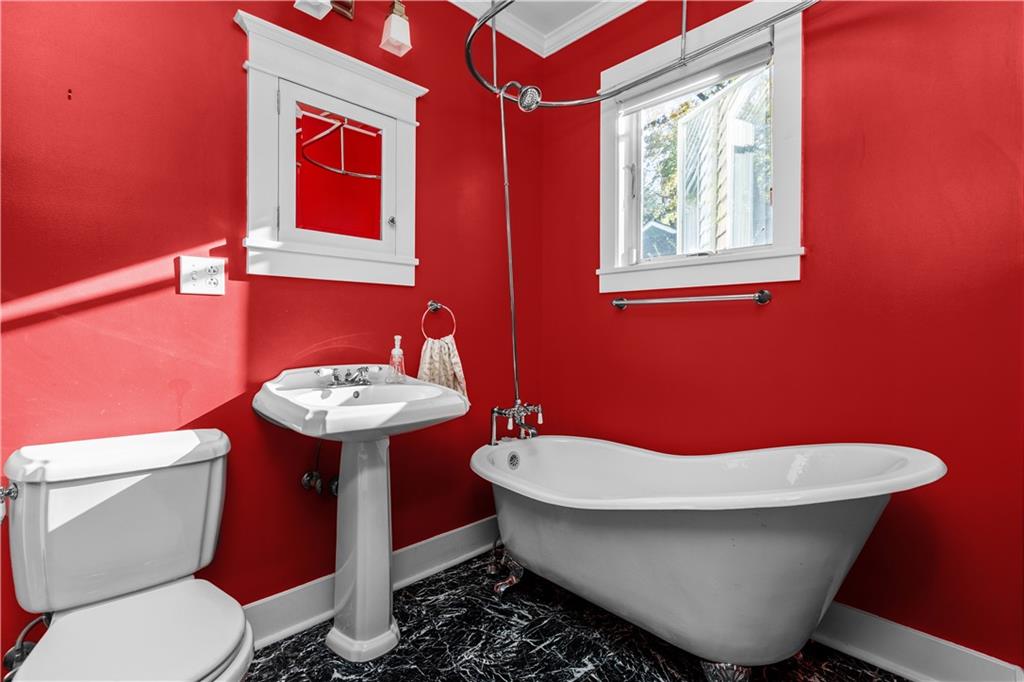 6314 Forward Avenue Pittsburgh, PA 15217 - Photo 22 of 27 a bathroom with a toilet sink and mirror