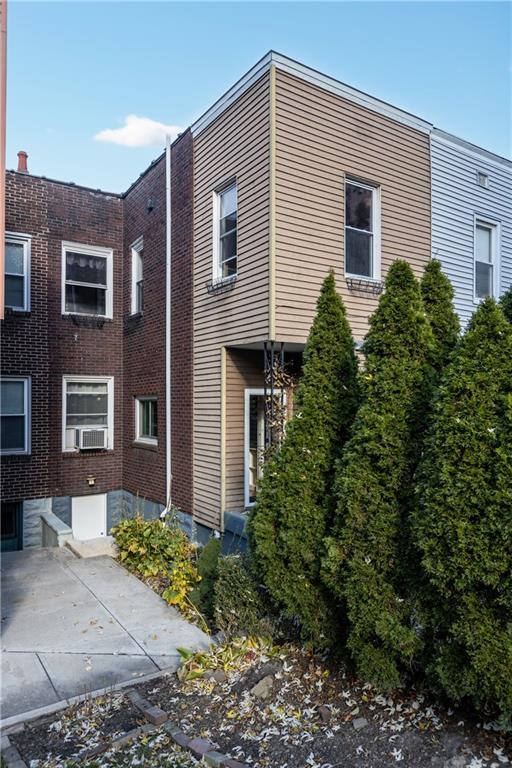 6314 Forward Avenue Pittsburgh, PA 15217 - Photo 23 of 27 a front view of a house with garden
