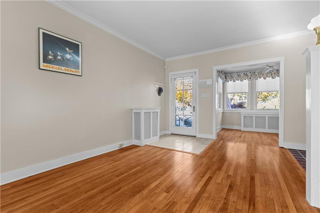 6314 Forward Avenue Pittsburgh, PA 15217 - Photo 3 of 27 an empty room with wooden floor and windows