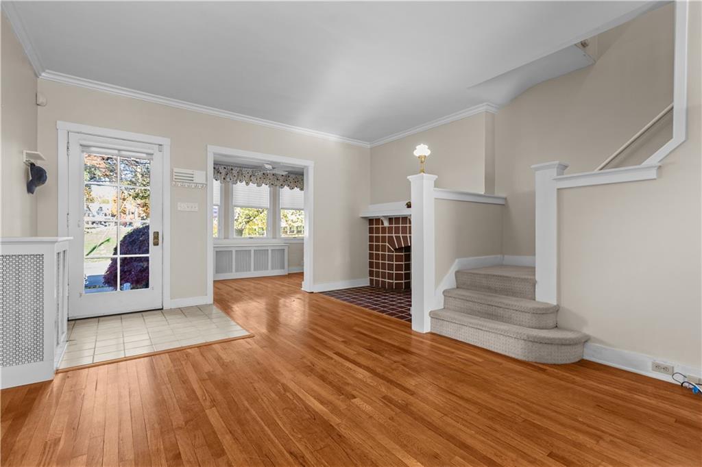 6314 Forward Avenue Pittsburgh, PA 15217 - Photo 4 of 27 an empty room with wooden floor and windows