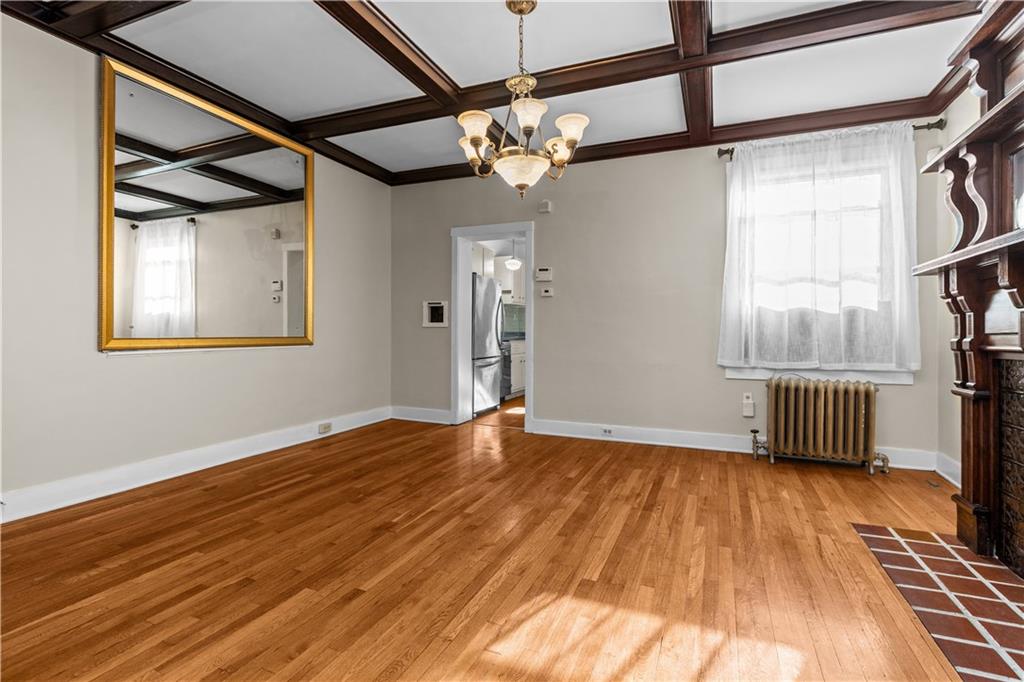 6314 Forward Avenue Pittsburgh, PA 15217 - Photo 8 of 27 a view of an empty room with wooden floor and a window