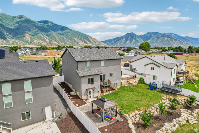 203 North 1900th Street West Mapleton, UT 84664 - Photo 43 of 48 Expansive backyard featuring a manicured lawn and multi-level landscaping