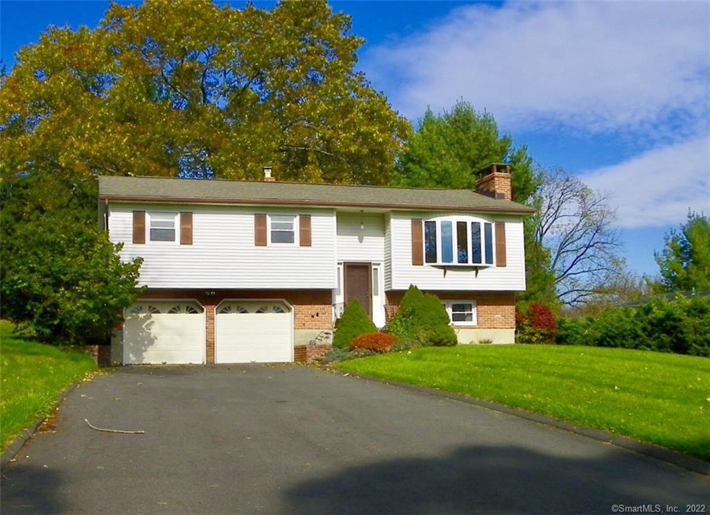 22 Williams Road New Fairfield, CT 06812 - Photo 1 of 1 a front view of a house with a yard and garage