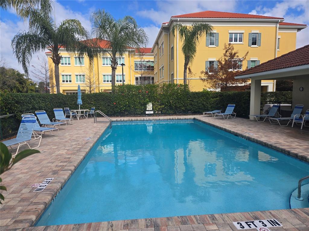 960 Cooper Street, Unit 203 Venice, FL 34285 - Photo 32 of 39 a view of a house with a swimming pool