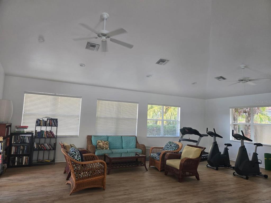 960 Cooper Street, Unit 203 Venice, FL 34285 - Photo 35 of 39 a living room with furniture and wooden floor