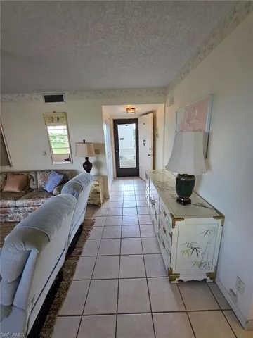a living room with a couch and a table