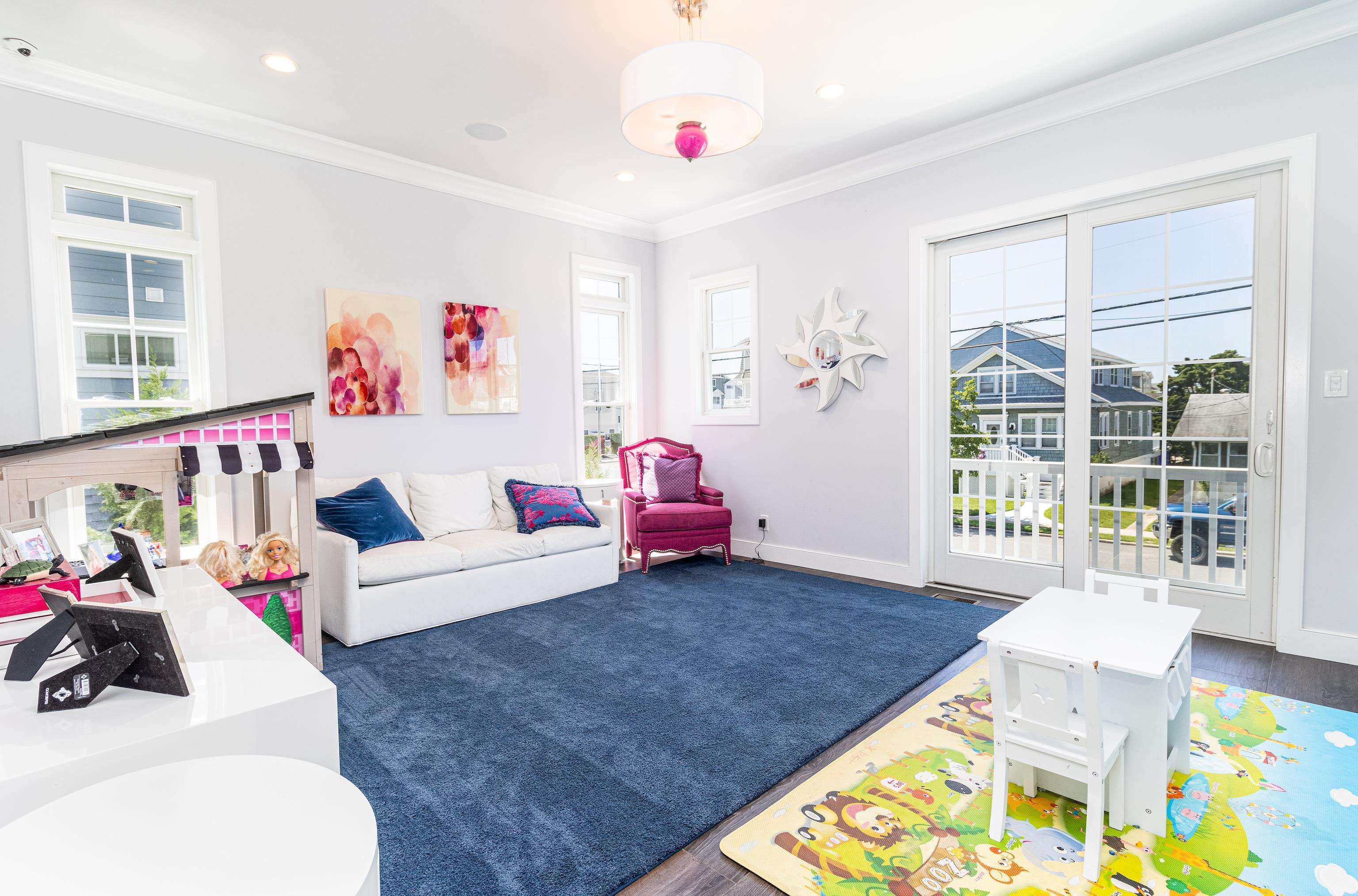 415 20th Avalon, NJ 08202 - Photo 11 of 50 a living room with furniture and a table