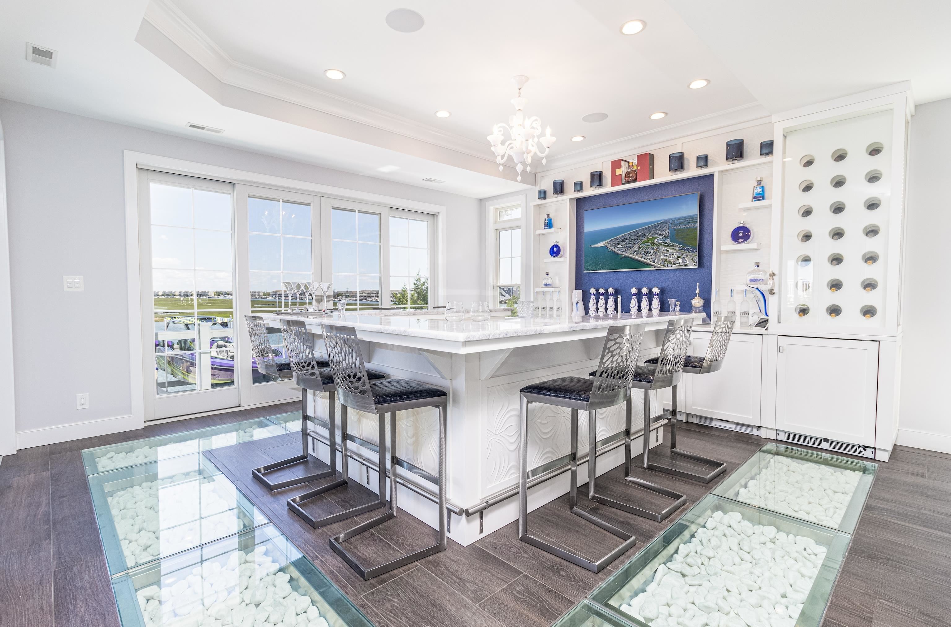 415 20th Avalon, NJ 08202 - Photo 18 of 50 a living room with furniture a large window and a table