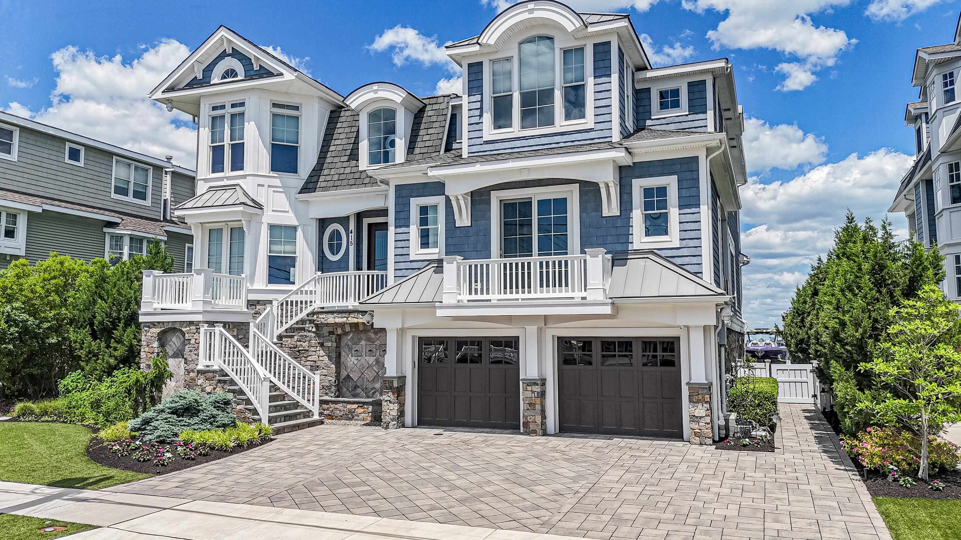 415 20th Avalon, NJ 08202 - Photo 2 of 50 a front view of a building with garden