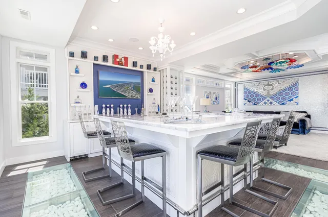 a kitchen with stainless steel appliances granite countertop a sink and a refrigerator