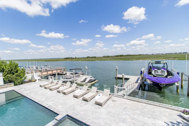 a view of a lake with couches and city view