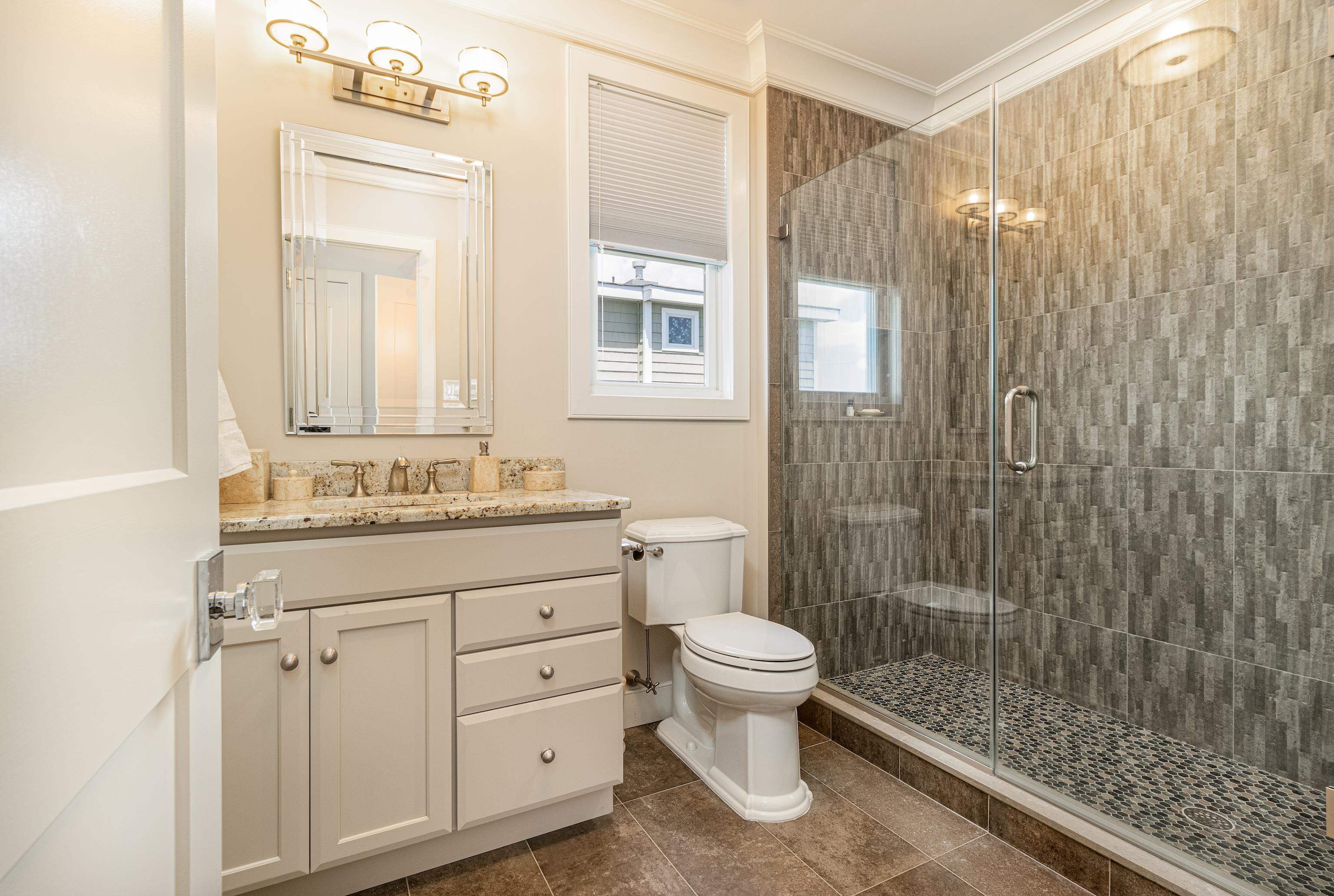 415 20th Avalon, NJ 08202 - Photo 27 of 50 a bathroom with a sink a toilet and shower