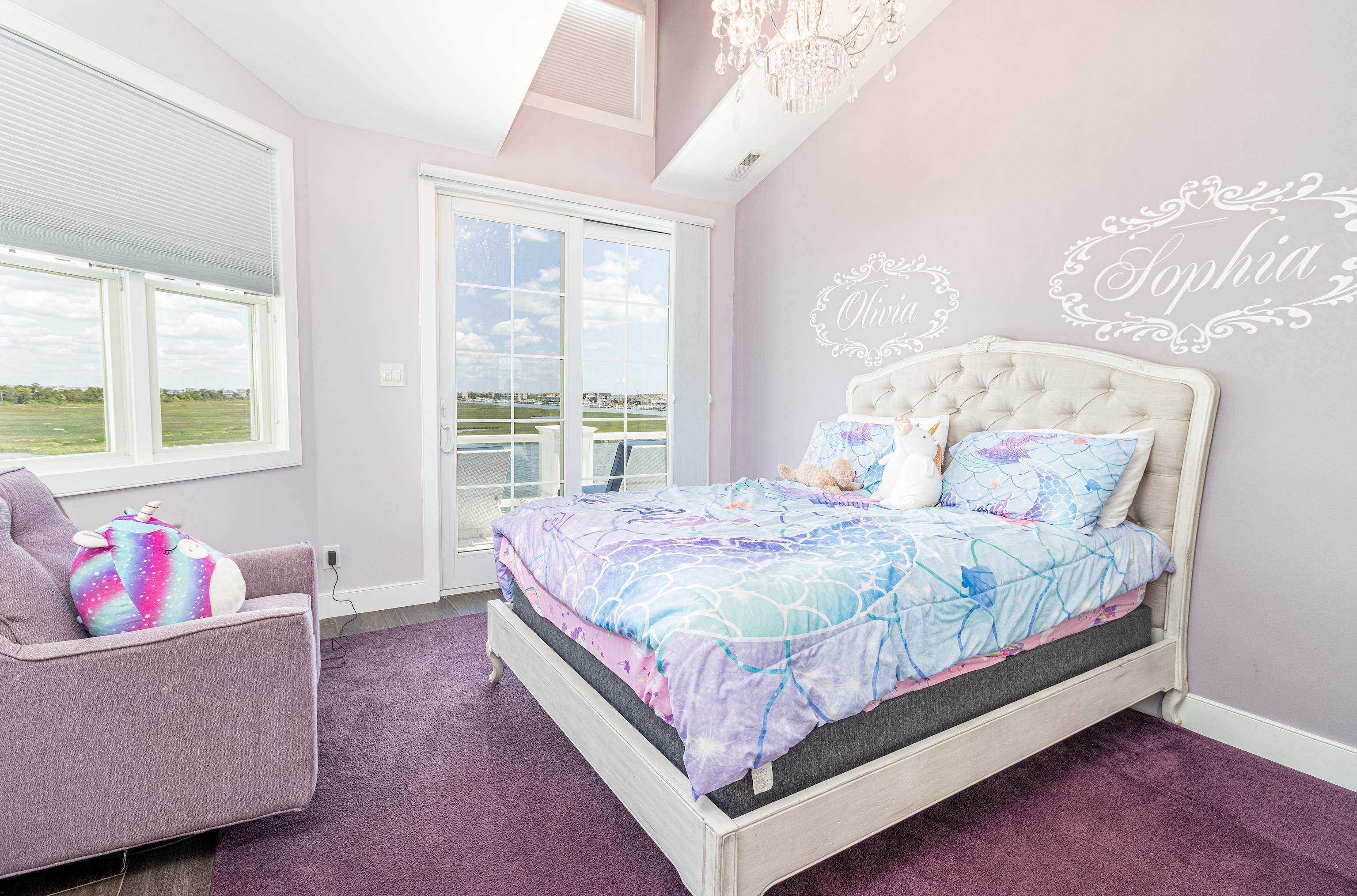 415 20th Avalon, NJ 08202 - Photo 29 of 50 a bed sitting in a bedroom next to a window with a large window