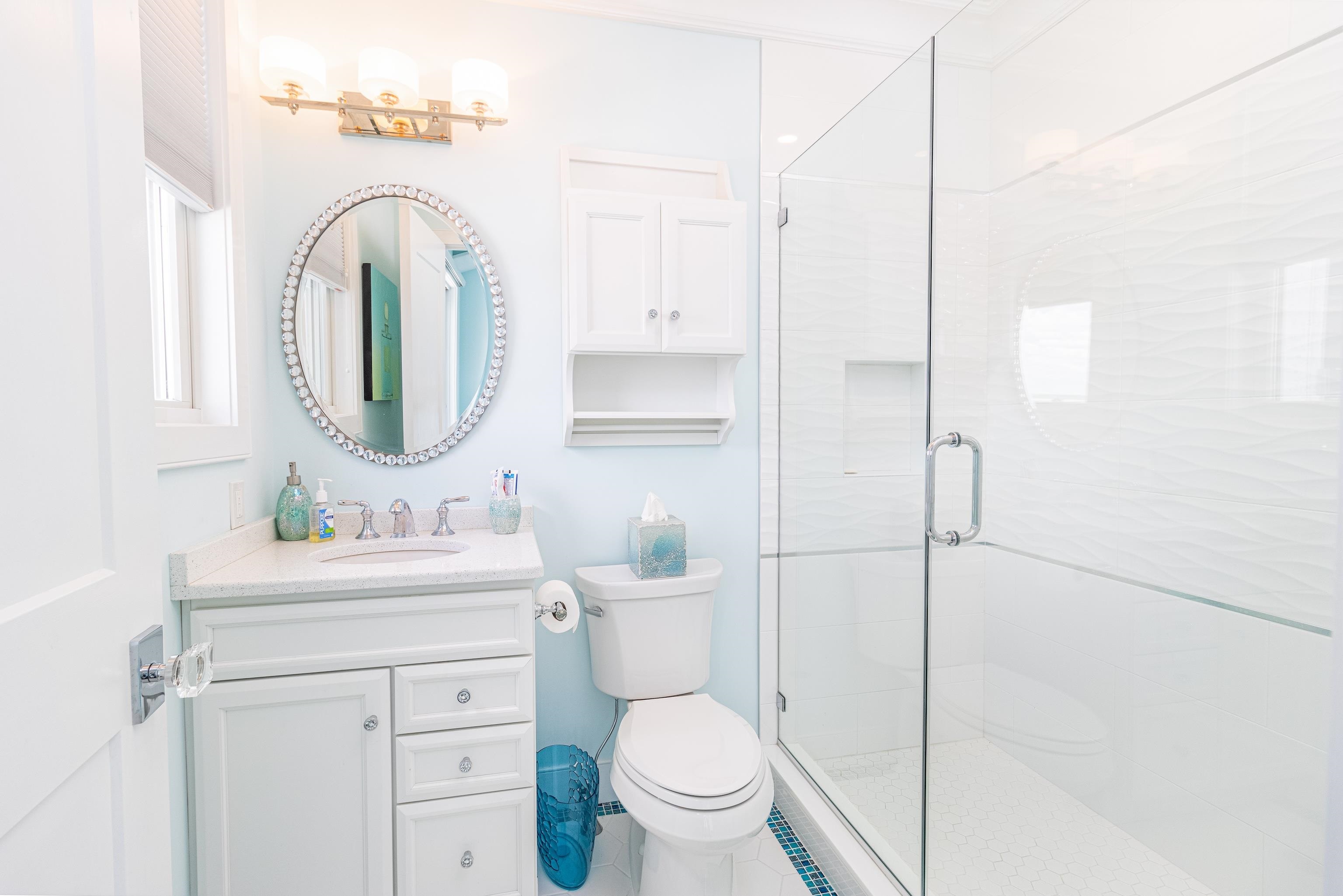 415 20th Avalon, NJ 08202 - Photo 34 of 50 a bathroom with a toilet sink and a mirror