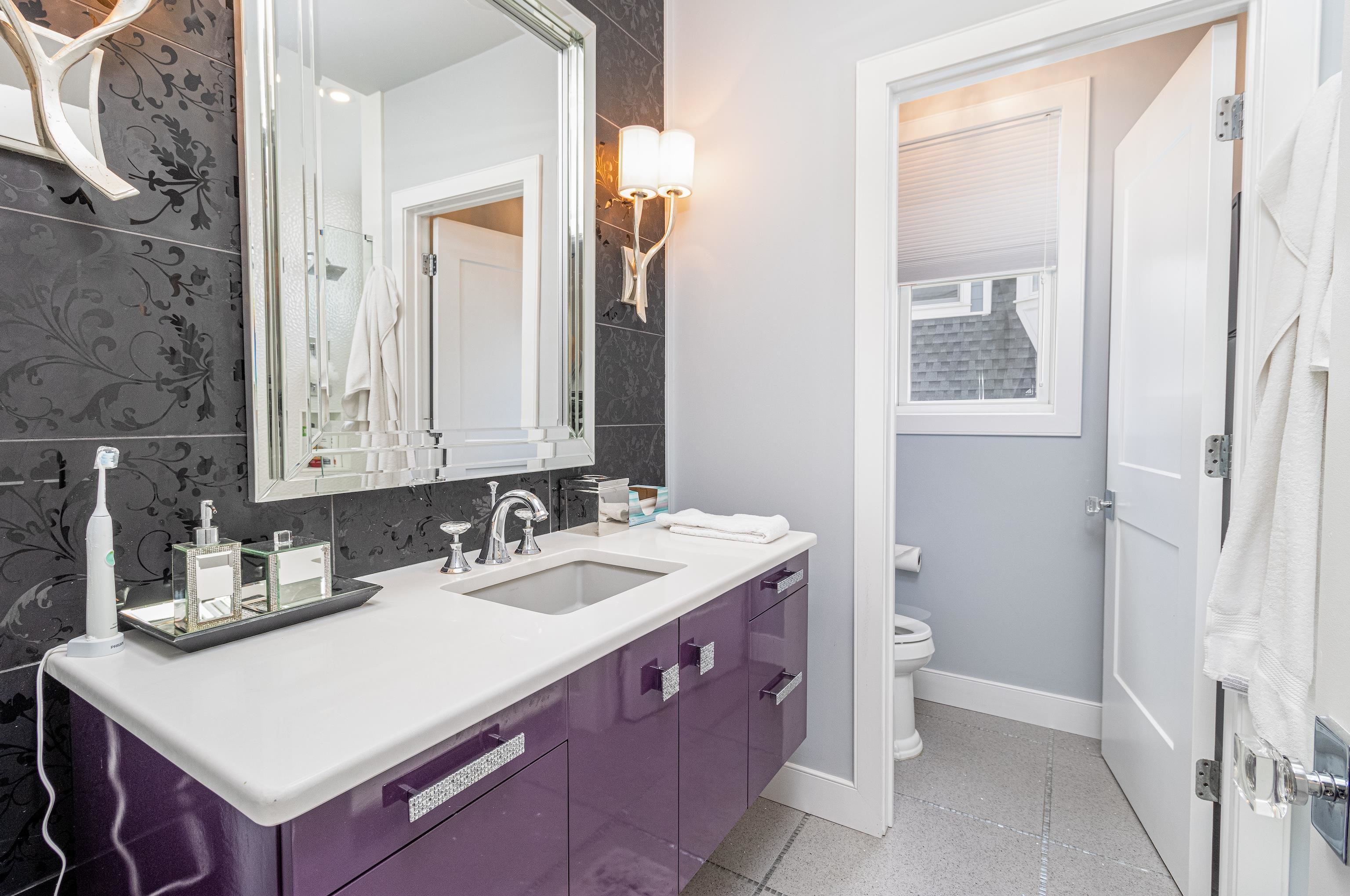 415 20th Avalon, NJ 08202 - Photo 39 of 50 a bathroom with a sink and a mirror