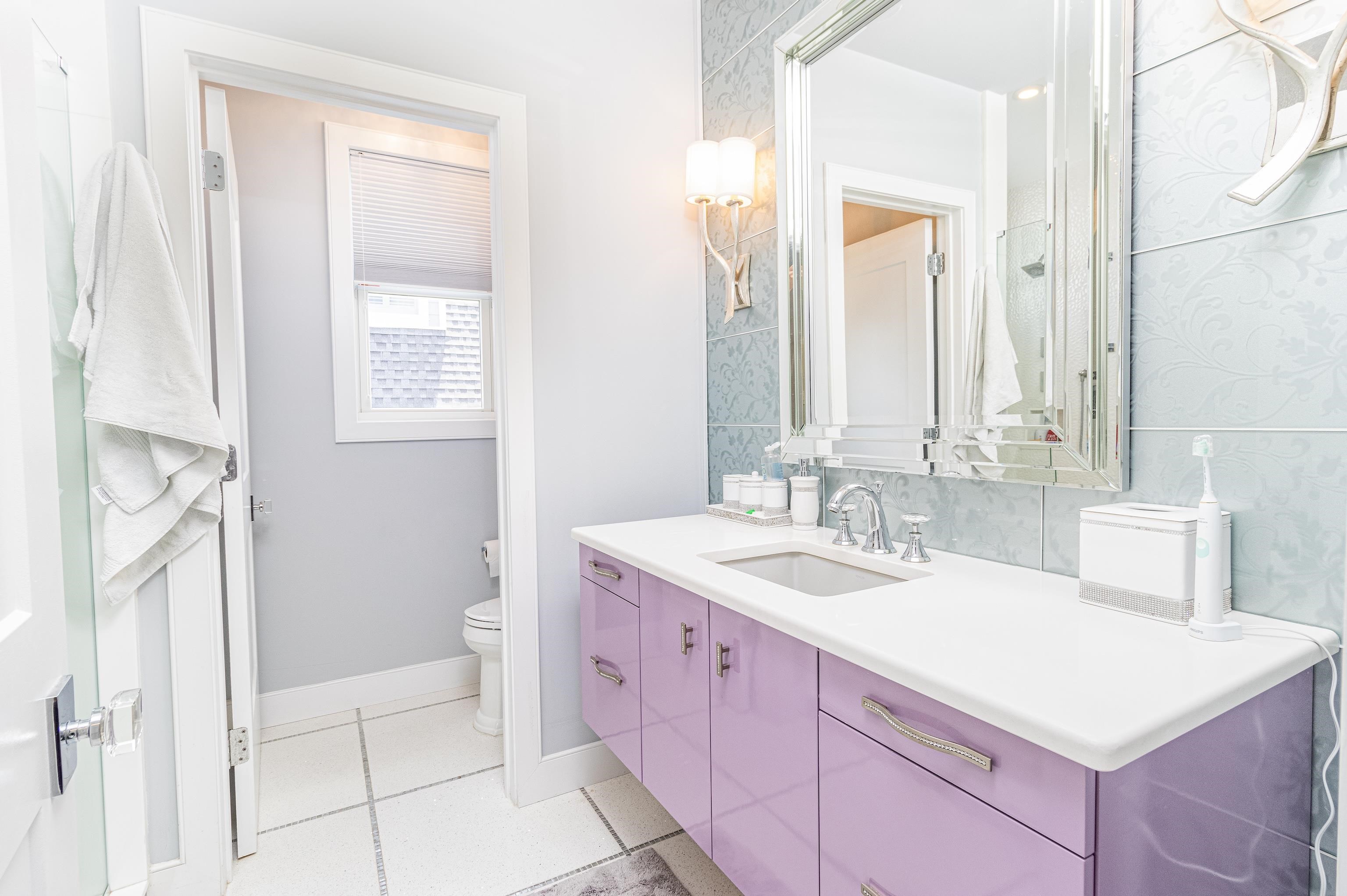 415 20th Avalon, NJ 08202 - Photo 40 of 50 a bathroom with a sink a vanity and a mirror