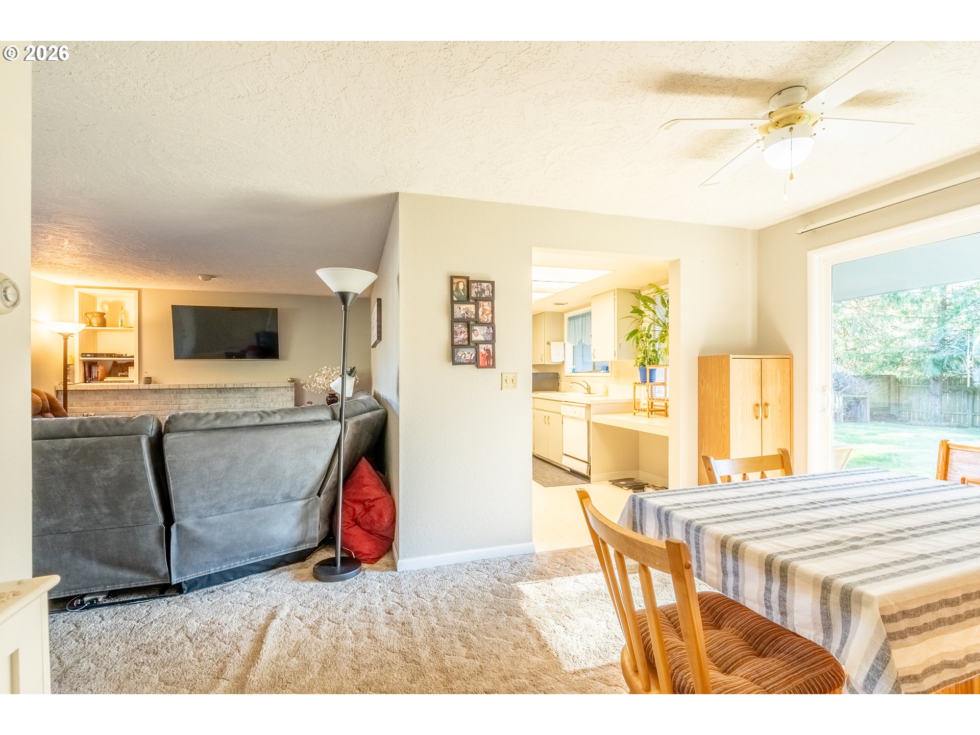 10480 Southwest Meadow Street Tigard, OR 97223 - Photo 12 of 20 a living room with furniture and a flat screen tv