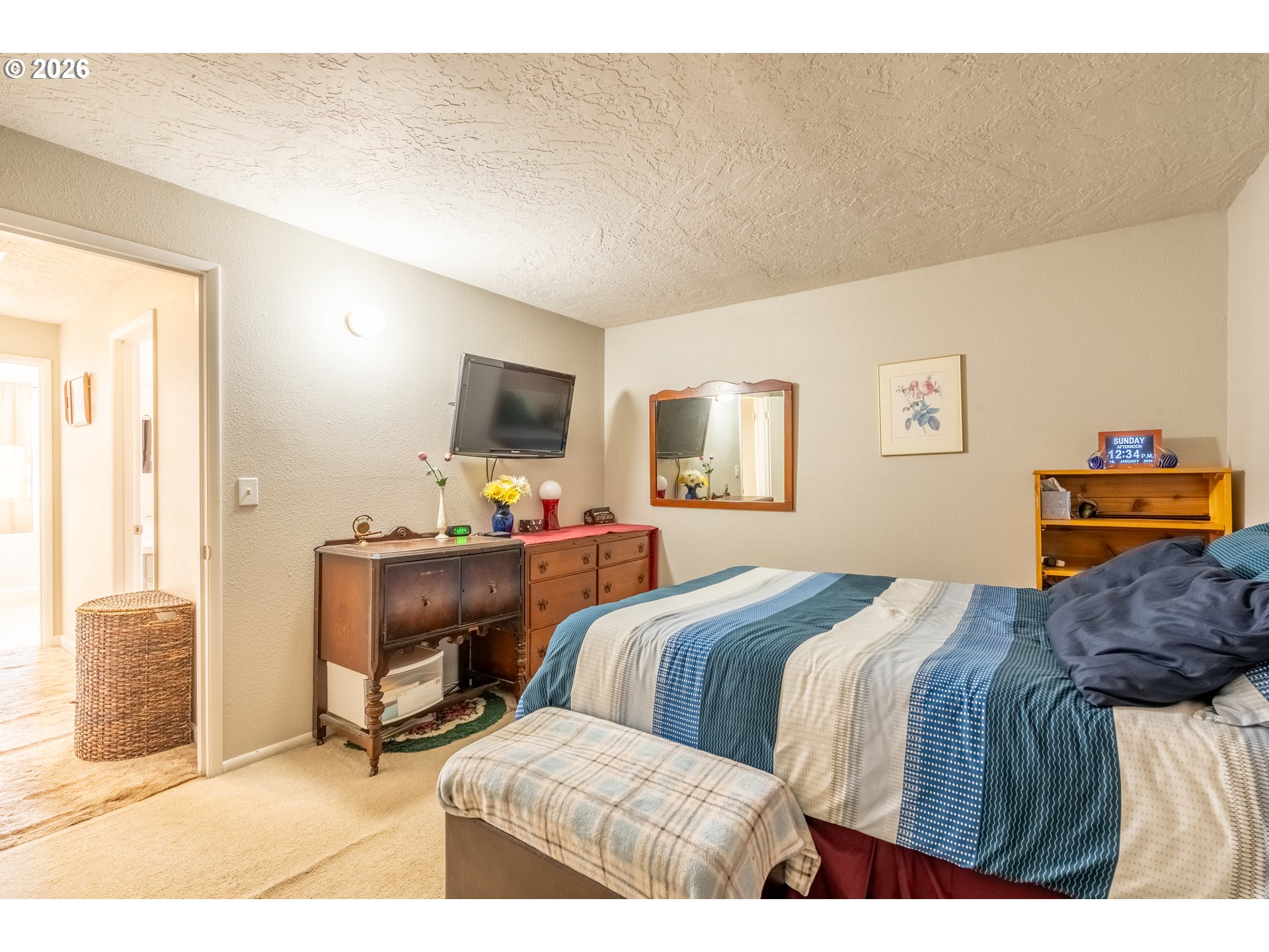 10480 Southwest Meadow Street Tigard, OR 97223 - Photo 16 of 20 a bedroom with a bed and a table