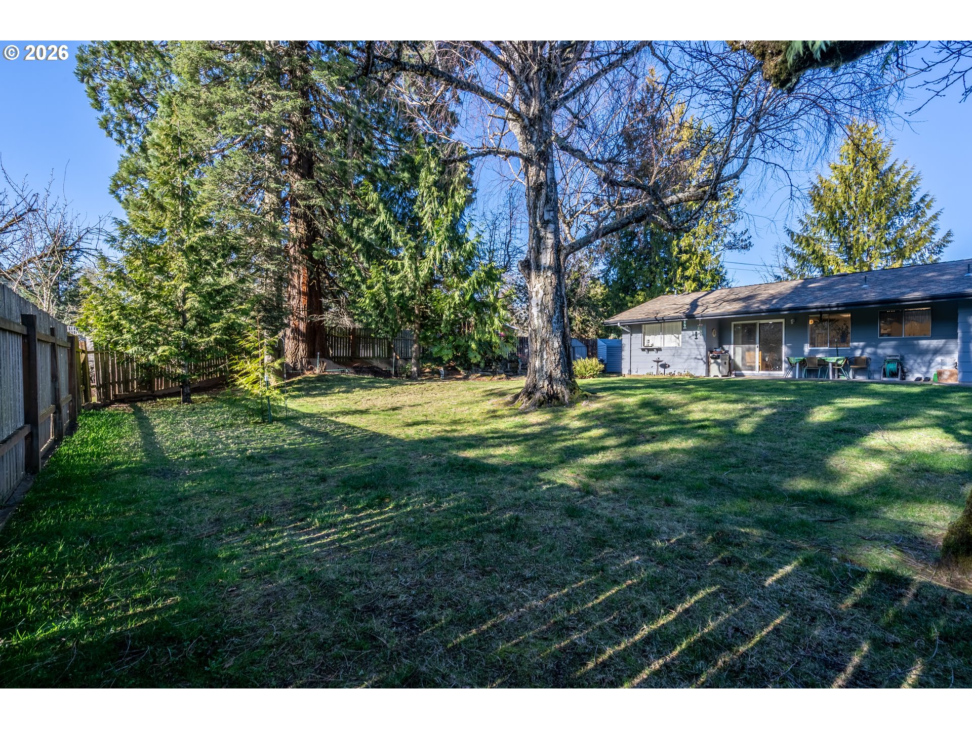 10480 Southwest Meadow Street Tigard, OR 97223 - Photo 20 of 20 a view of a house with a big yard