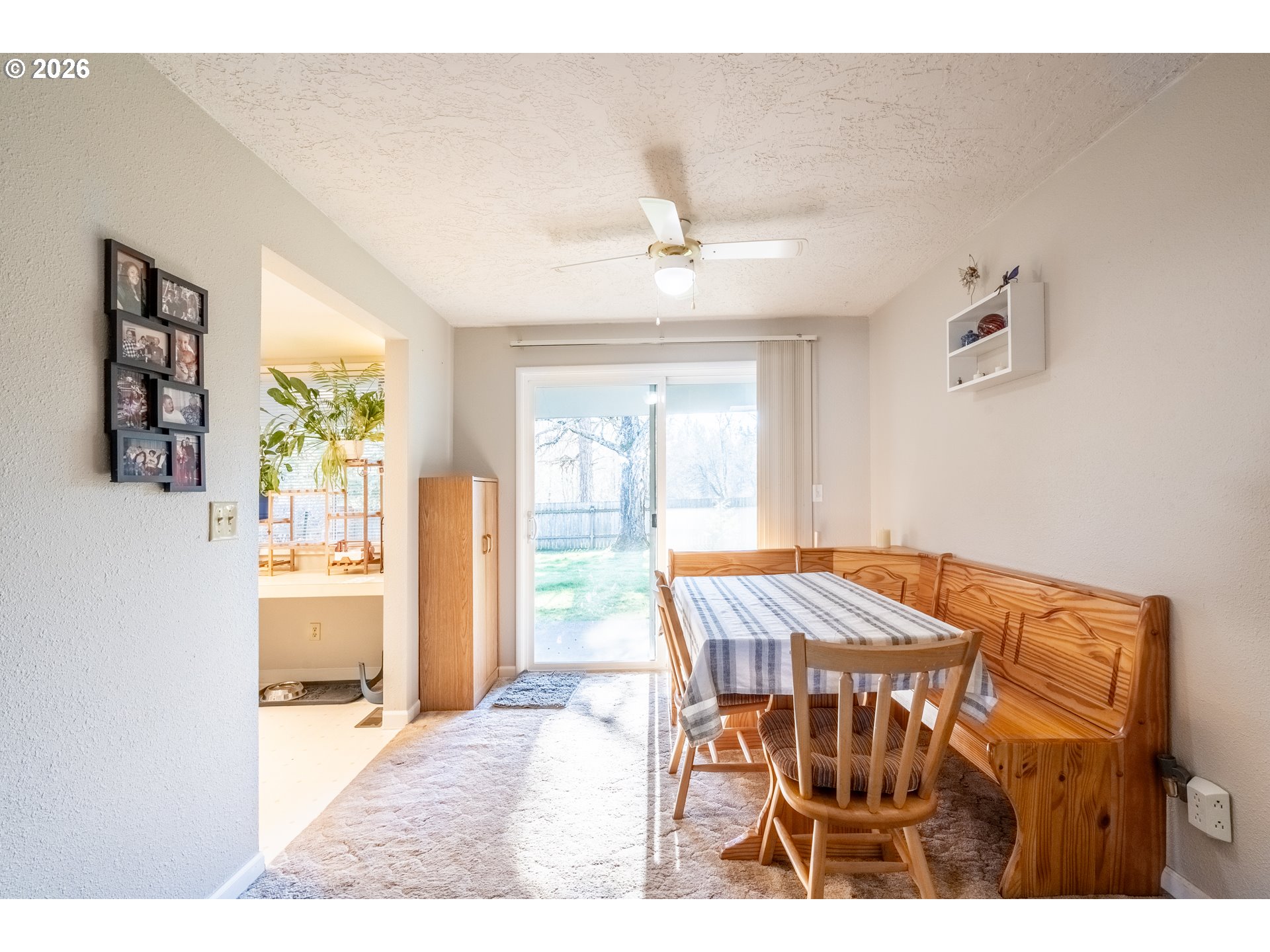 10480 Southwest Meadow Street Tigard, OR 97223 - Photo 6 of 20 a view of a dining room with furniture and a window