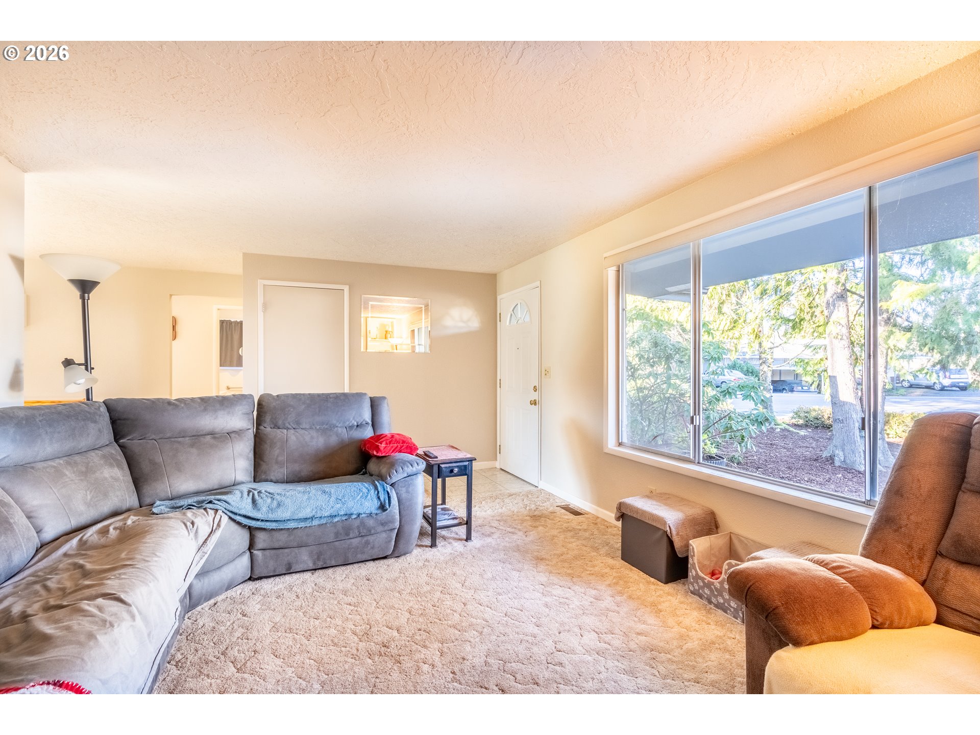 10480 Southwest Meadow Street Tigard, OR 97223 - Photo 10 of 20 a living room with furniture and a large window