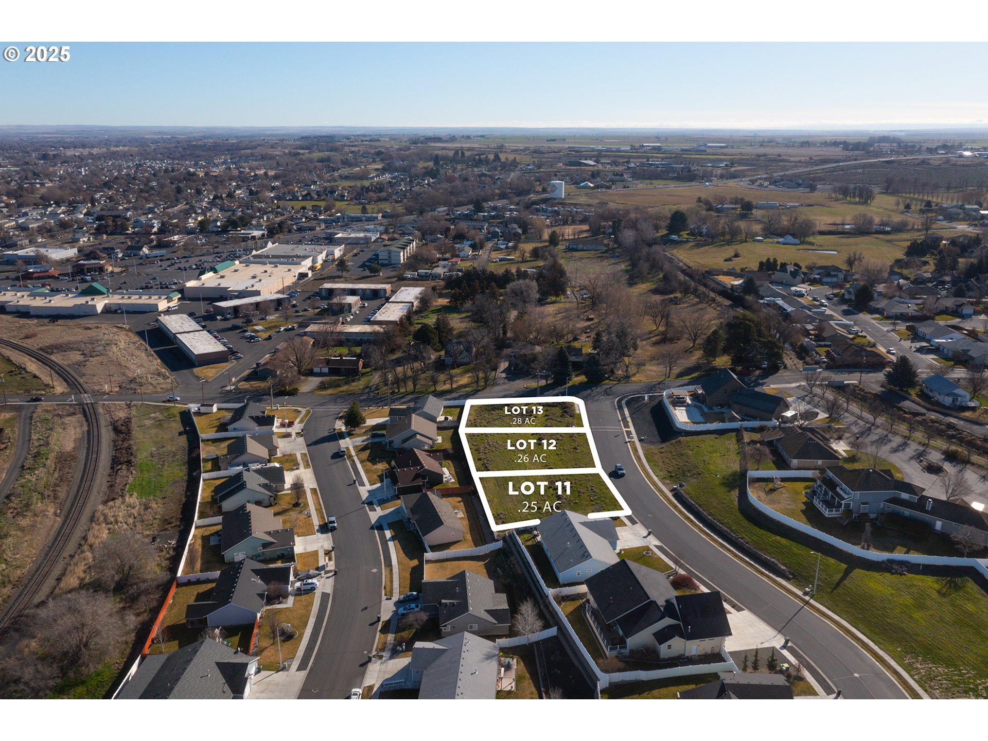 102 Southwest Desert Sky Drive, Unit 13 Hermiston, OR 97838 - Photo 6 of 7 an aerial view of a city